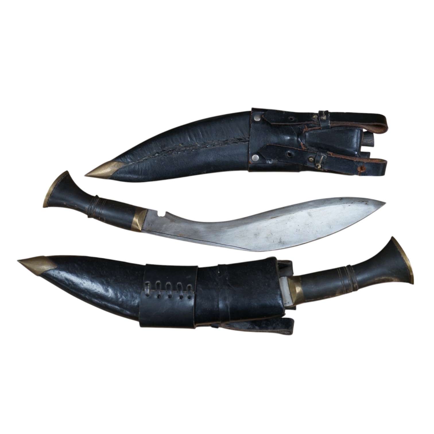 Two leather cased kukri, 43cm long. Condition - good